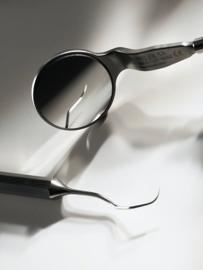black framed eyeglasses on white textile