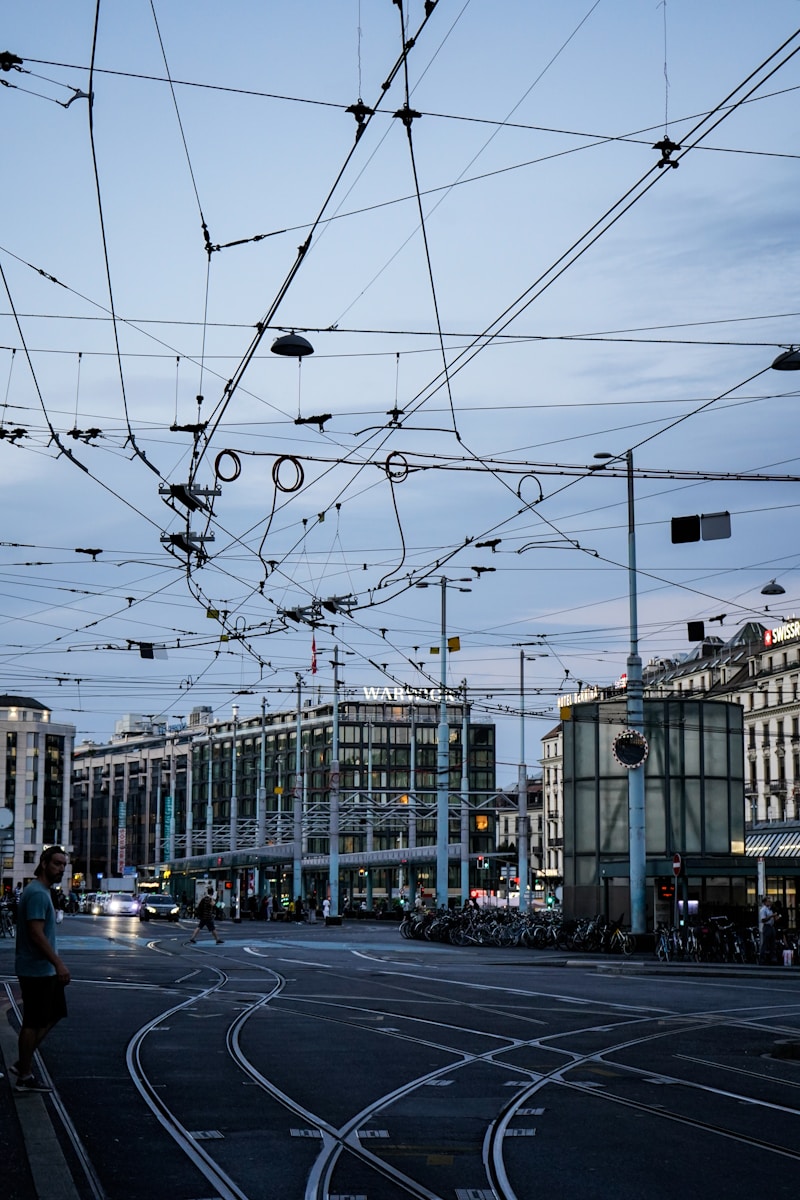 a street with buildings and wires above it